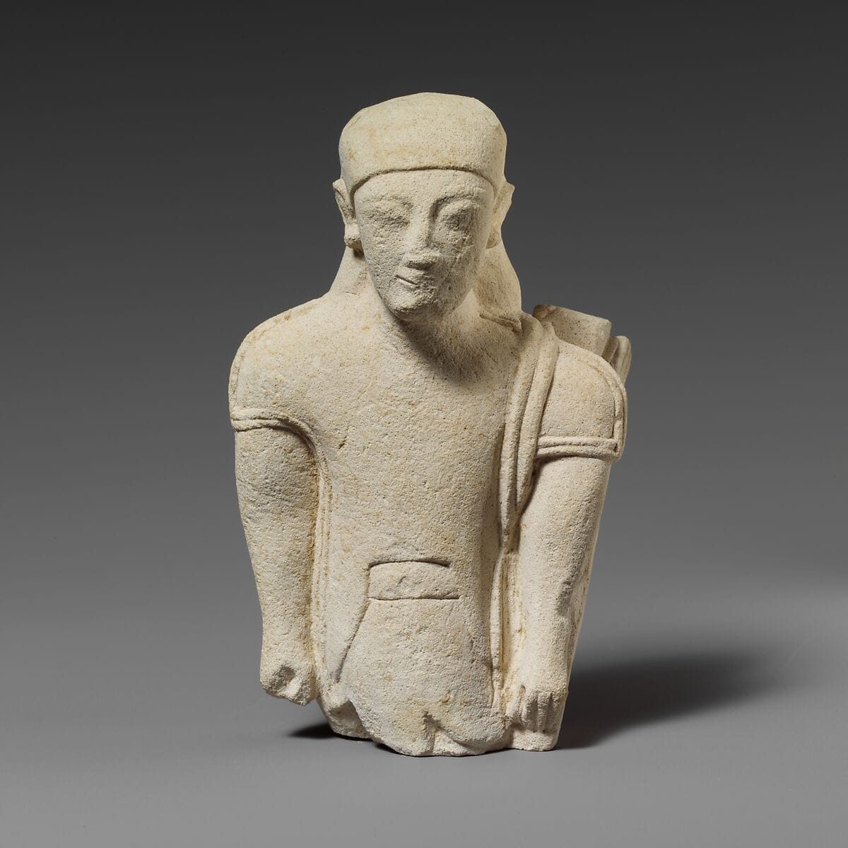 Limestone statuette of a “hunter” in Egyptianizing dress, Archaic II Cypriot