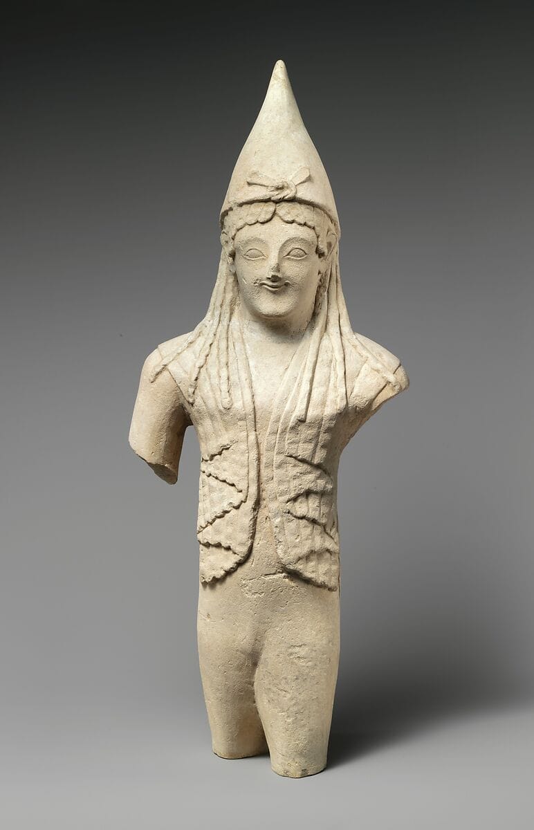 Limestone statuette of a youthful votary wearing a pointed cap, Archaic II Cypriot