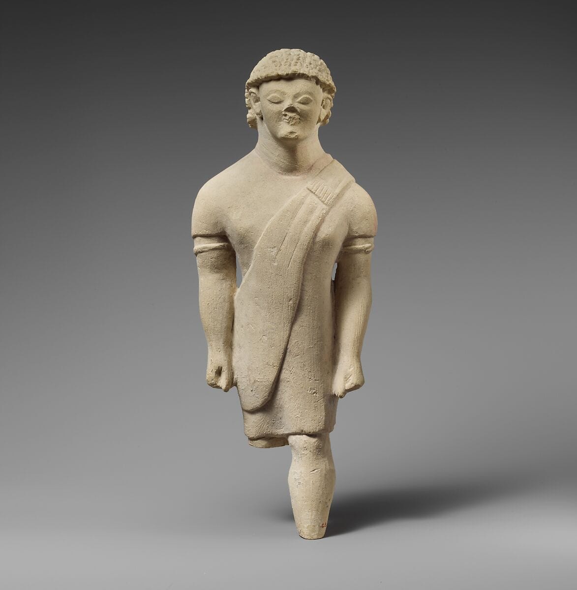Limestone statuette of a beardless male votary in Greek dress, Archaic II Cypriot