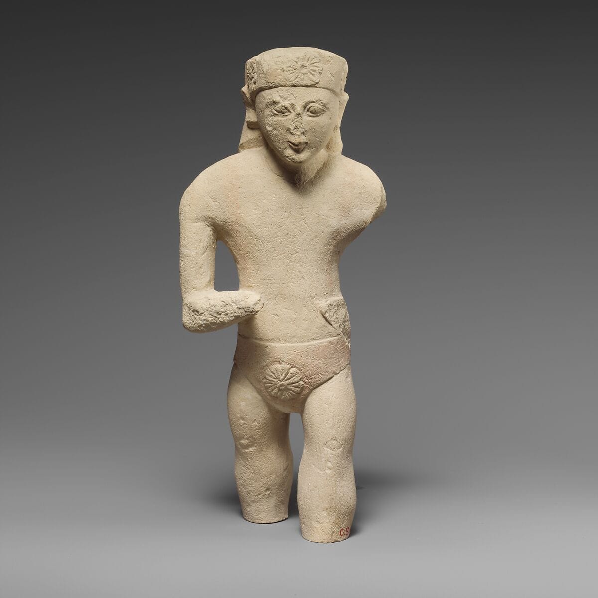 Limestone statuette of a male votary with Cypriot shorts and a diadem, Archaic II Cypriot