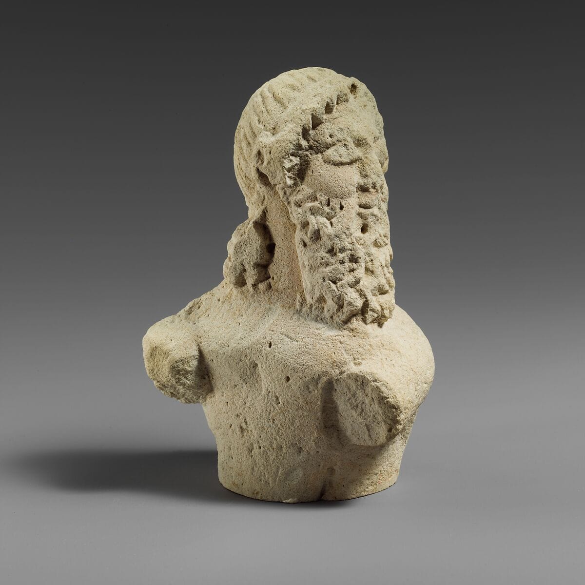 Fragment of a limestone statuette of a silen (?), Archaic II Cypriot