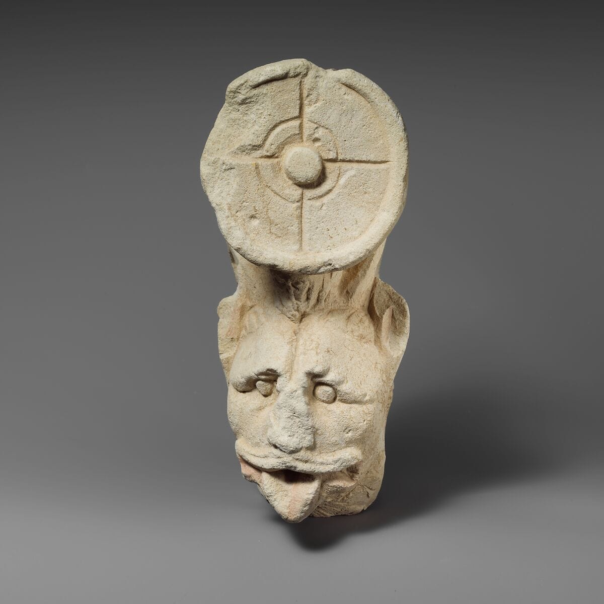 Fragment of a limestone throne (?) with the head of a horned lion, Roman Cypriot statue