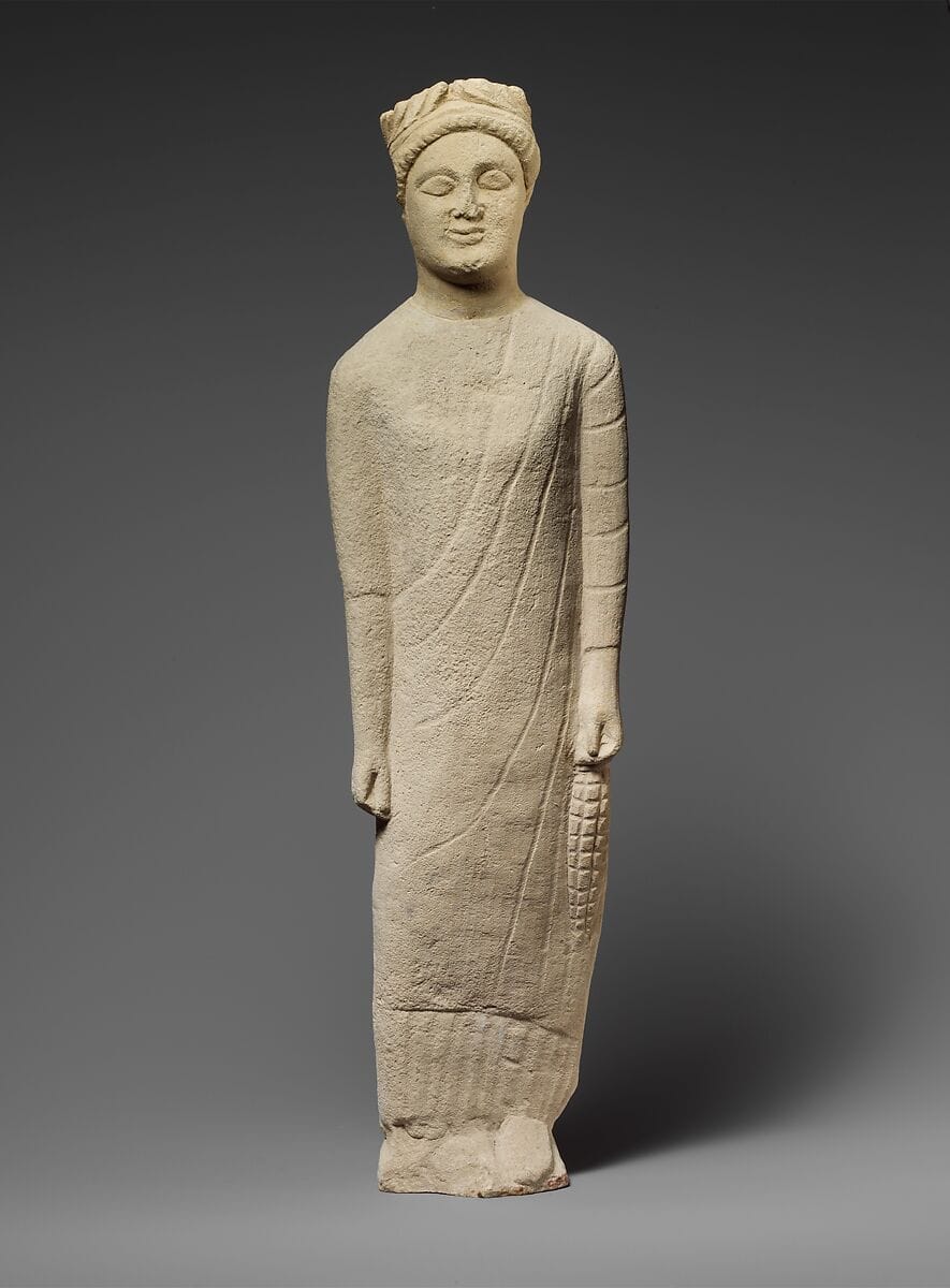 Limestone statuette of a beardless male votary with a wreath of leaves, Classical Cypriot