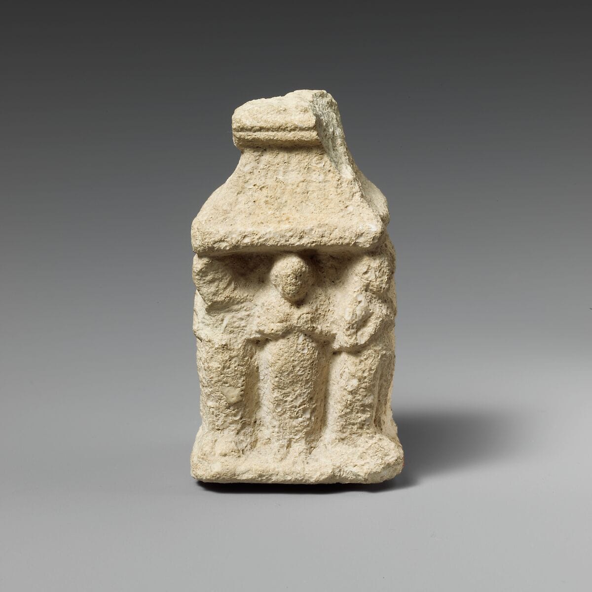 Limestone naiskos with female figures holding their breasts, Classical Cypriot statue