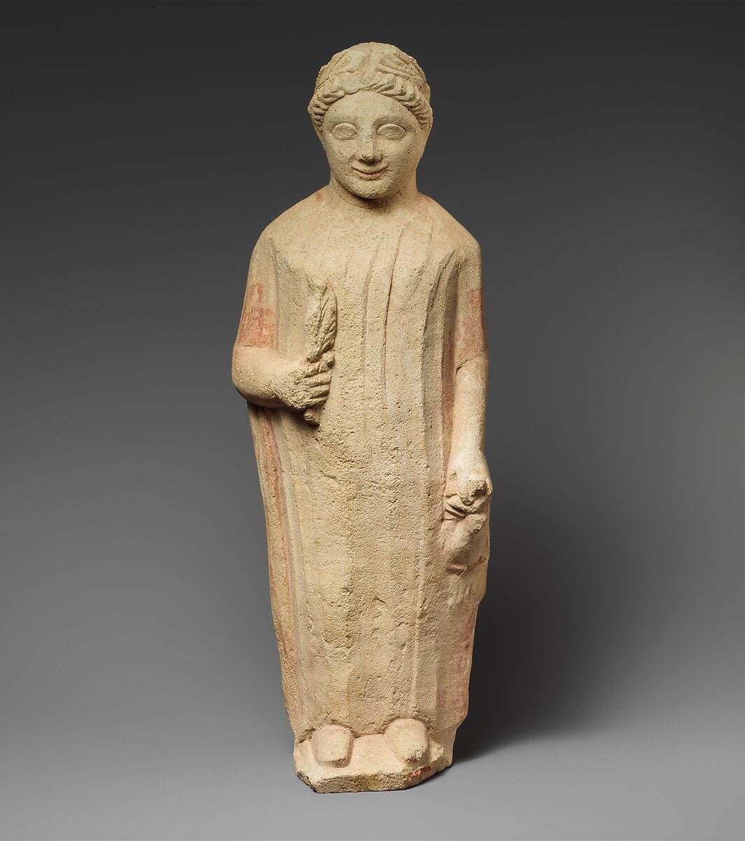Limestone statuette of a boy holding a bird and a branch of leaves, Classical Cypriot