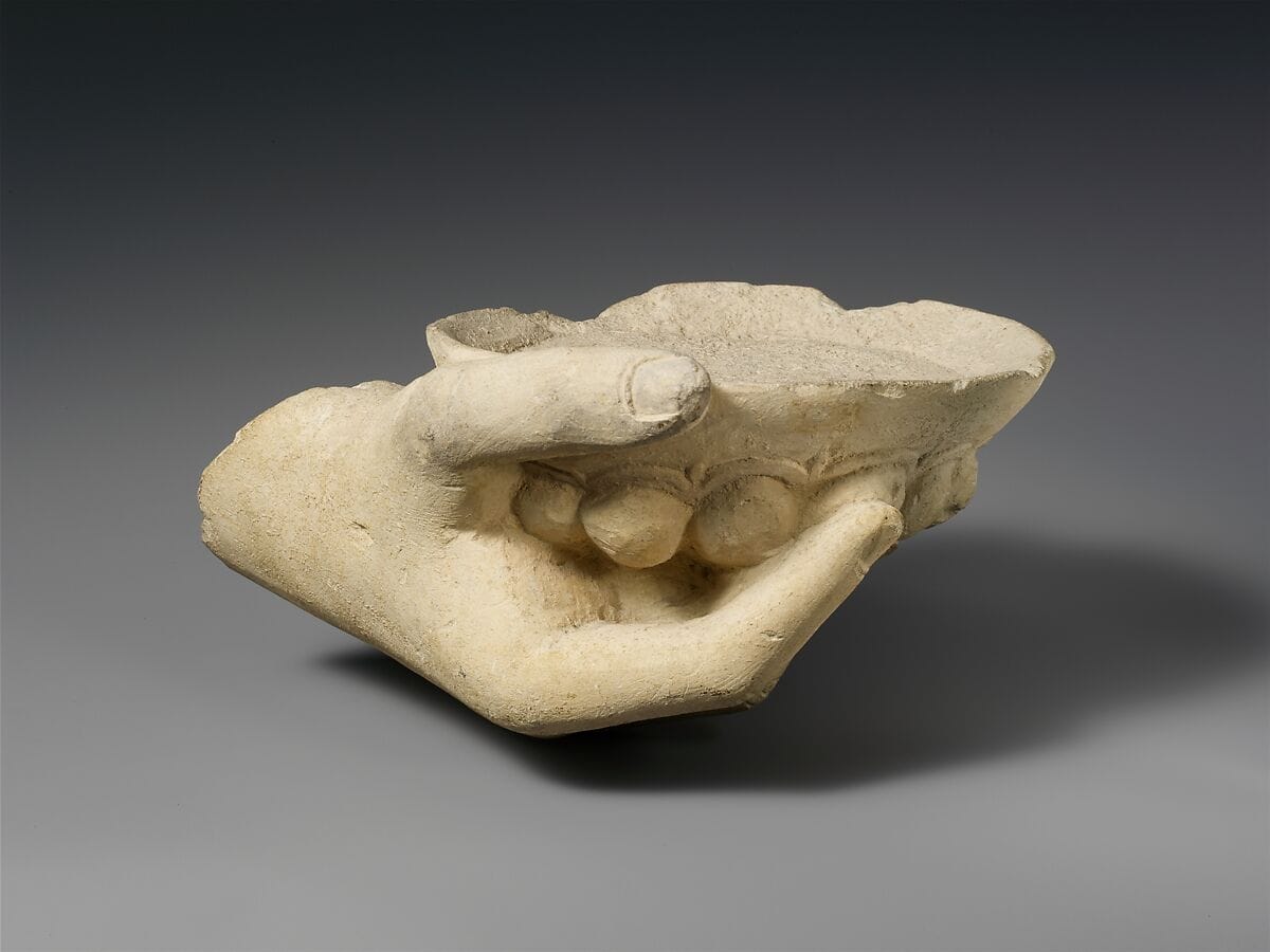 Limestone statue fragment of a right hand holding a phiale (libation bowl), Classical Cypriot