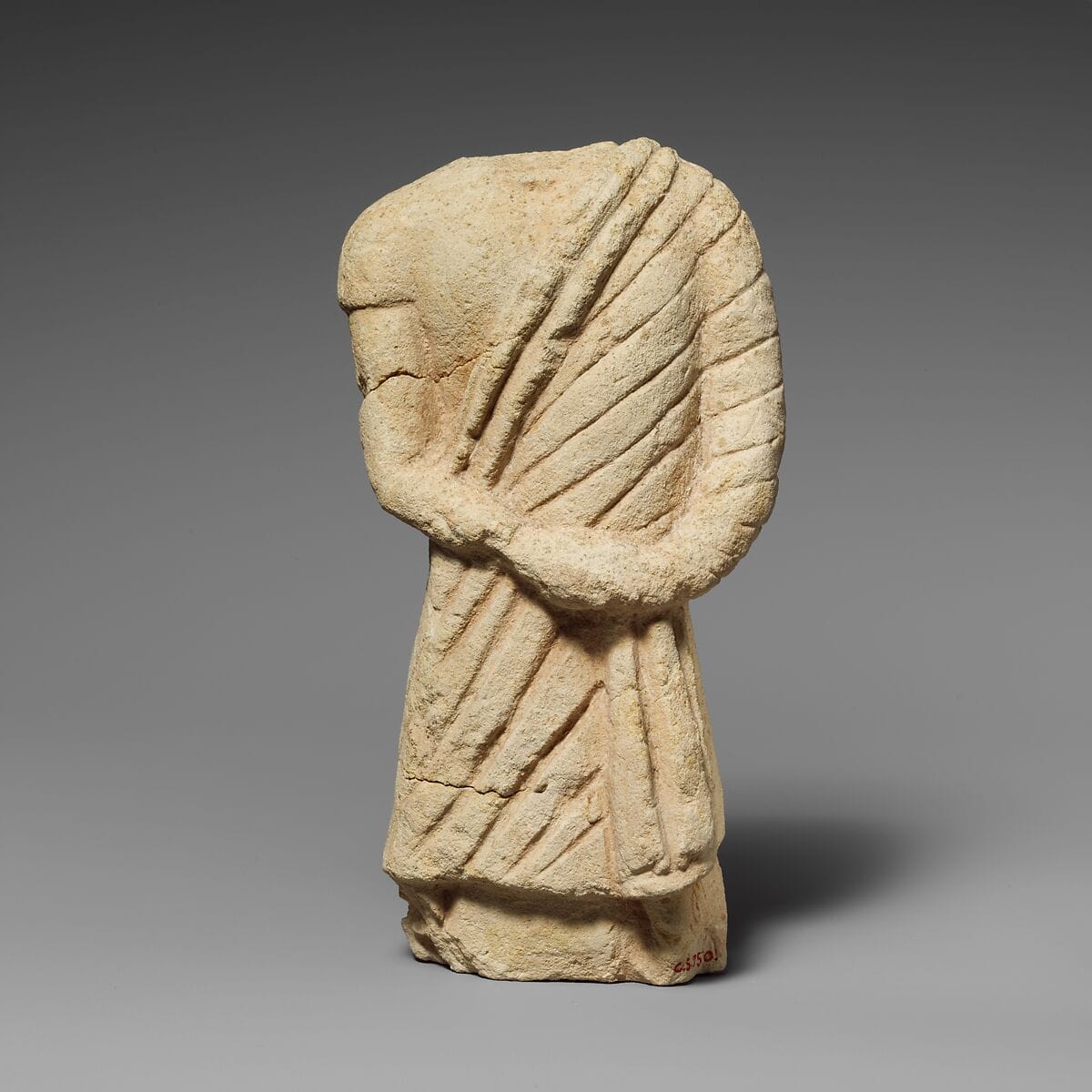 Fragment of a limestone statuette of a male votary, Hellenistic Cypriot