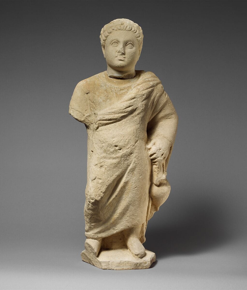 Limestone statuette of a boy holding an amphora, Hellenistic Cypriot jar