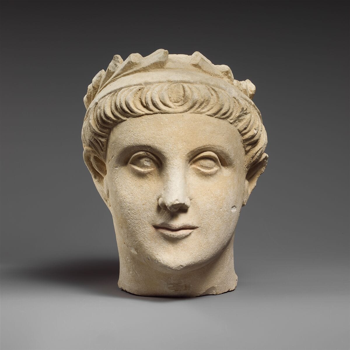 Limestone head of a wreathed youth, Classical Cypriot statue