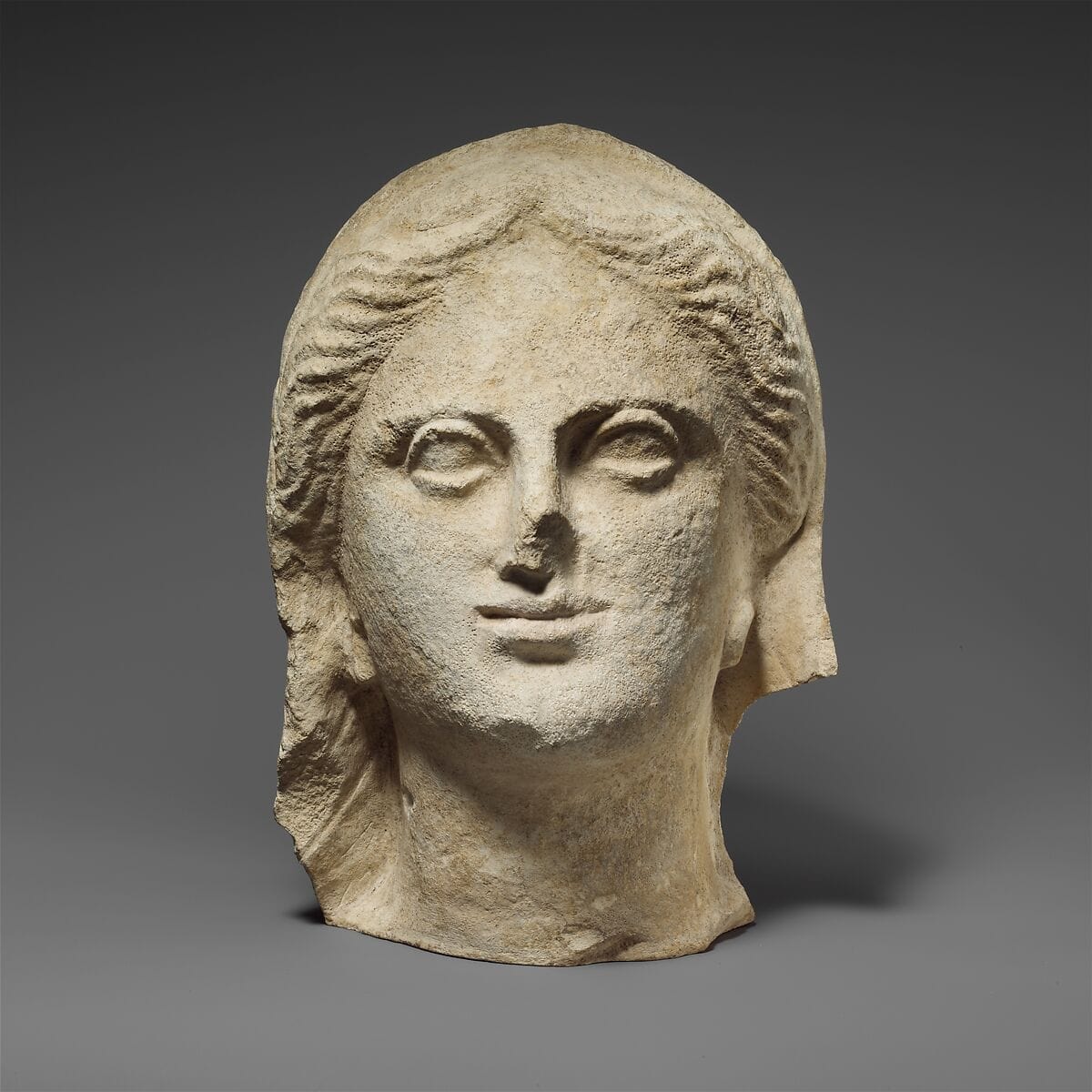 Limestone head of a veiled female votary, Hellenistic Cypriot statue