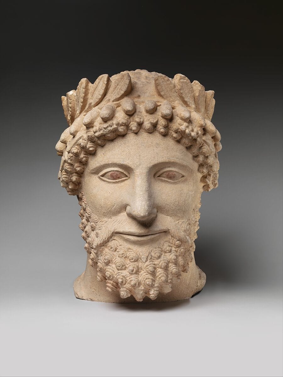 Limestone head of a bearded man wearing a wreath, Classical Cypriot statue