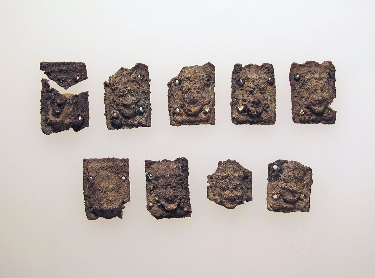 Beads with female head, Bronze Age Cypriot jewelry