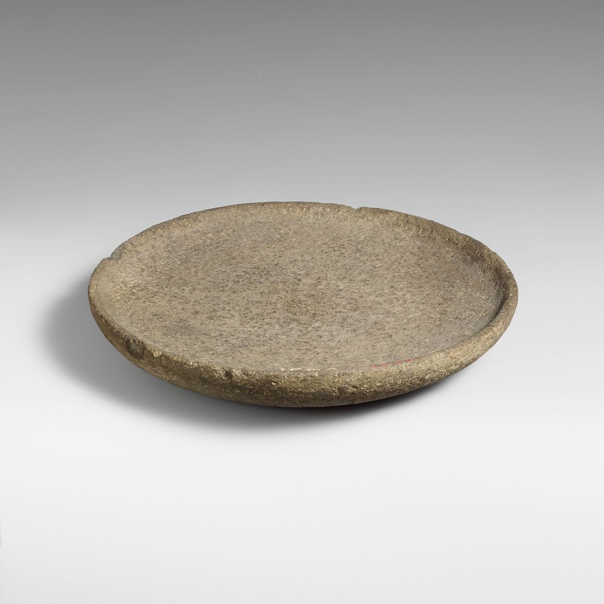 Basalt mortar or plate, Late Bronze Age II Cypriot dish