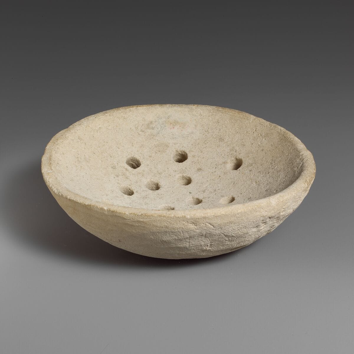 Limestone strainer, Bronze Age Cypriot