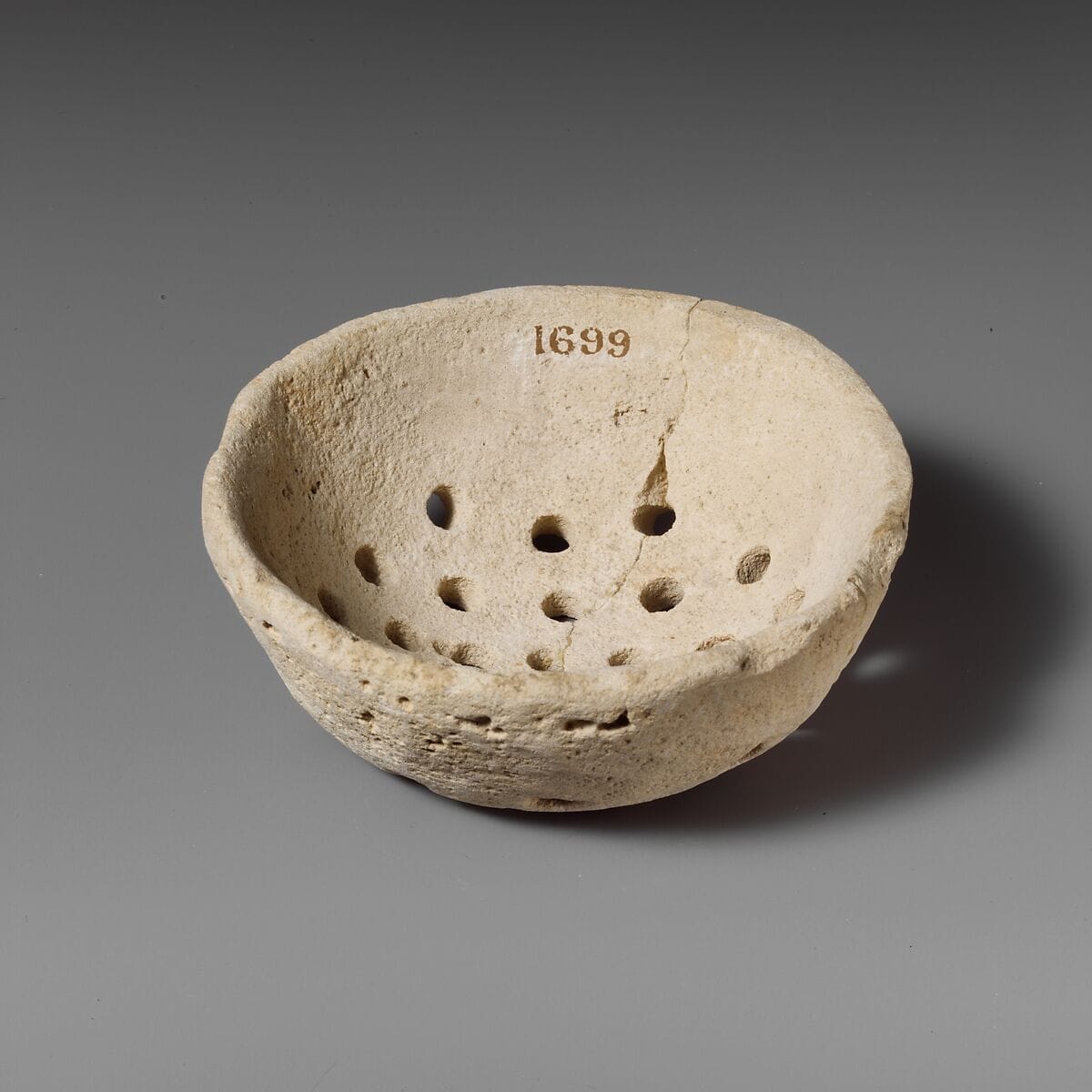 Limestone strainer, Bronze Age Cypriot