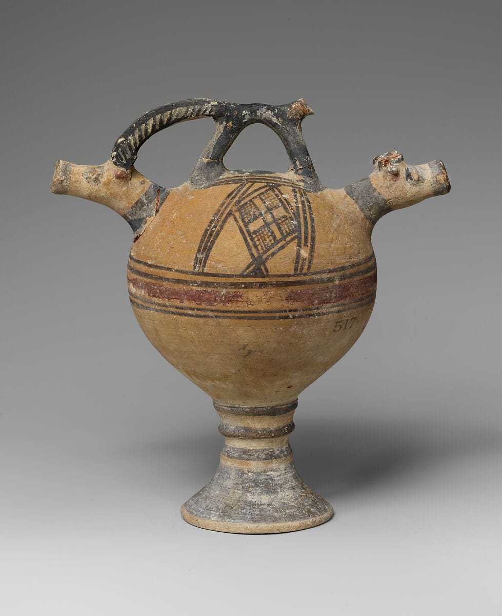 Terracotta vase on a high foot with two goats' heads in relief, Geometric I Cypriot complex vessel