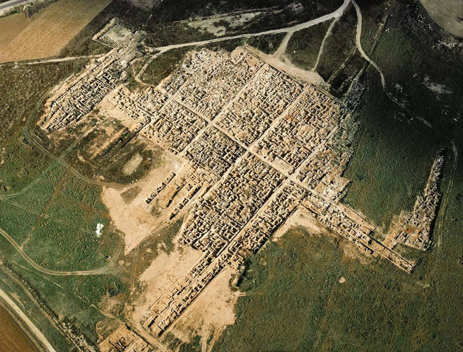 The excavated part of Enkomi from the air, with the straight streets and rectangular blocks of the town rebuilt after c. 1200 BC. Photo: Cypern20, CC BY-SA 4.0