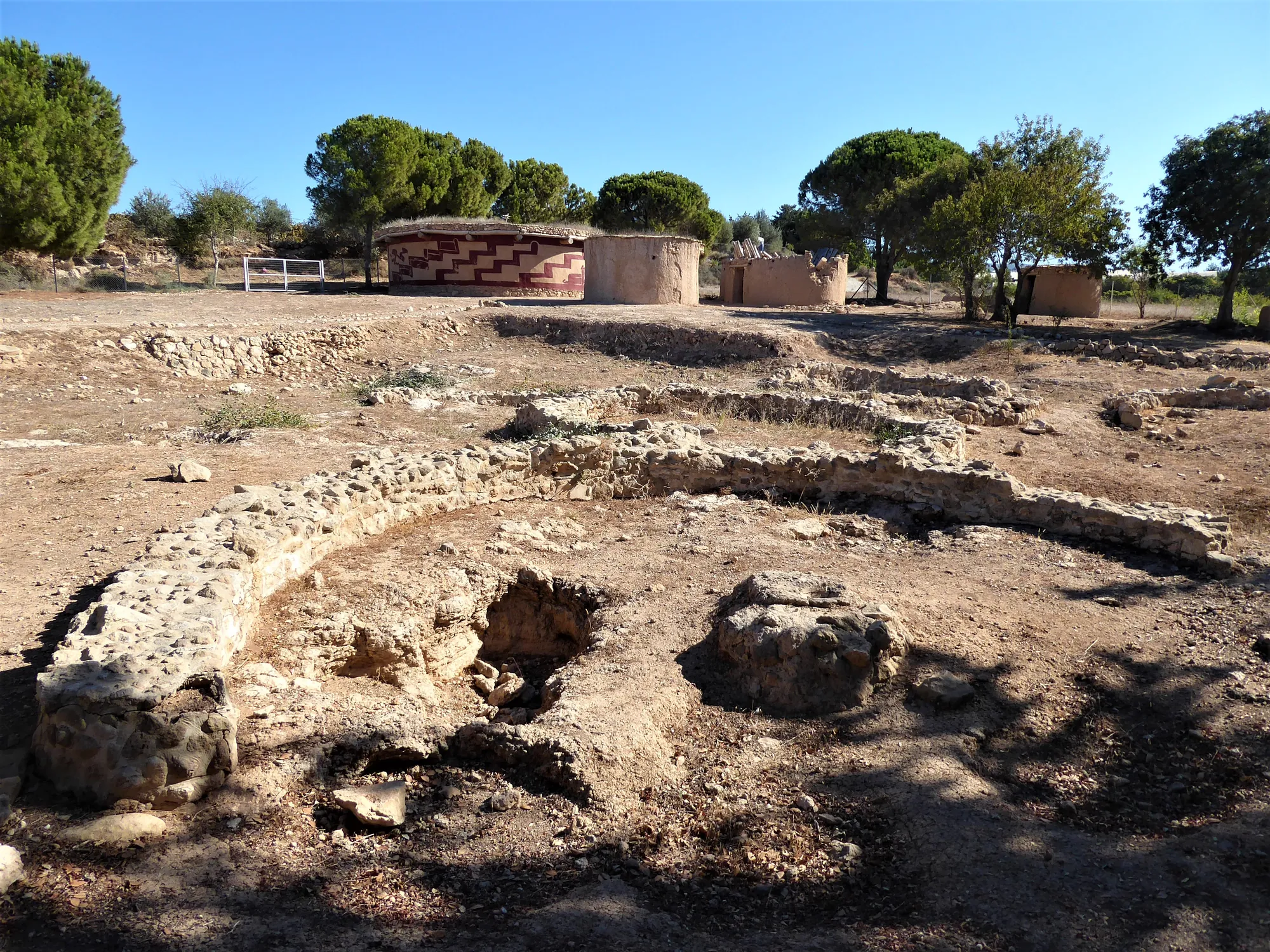 Stone footing of an excavated Chalcolithic round house at Lemba-Lakkous, with a pit cut into the floor area. Photo: Chris06, CC BY-SA 4.0, via Wikimedia Commons