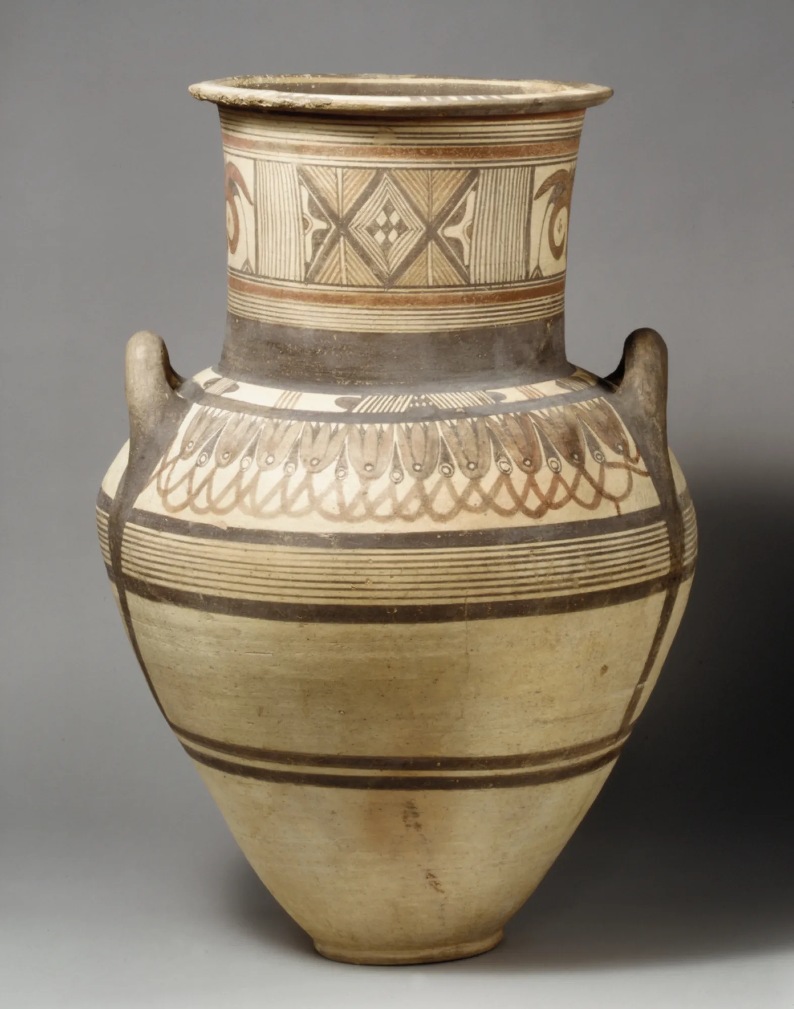 A tall two-handled painted jar with bands and a frieze of lotus flowers on the shoulder