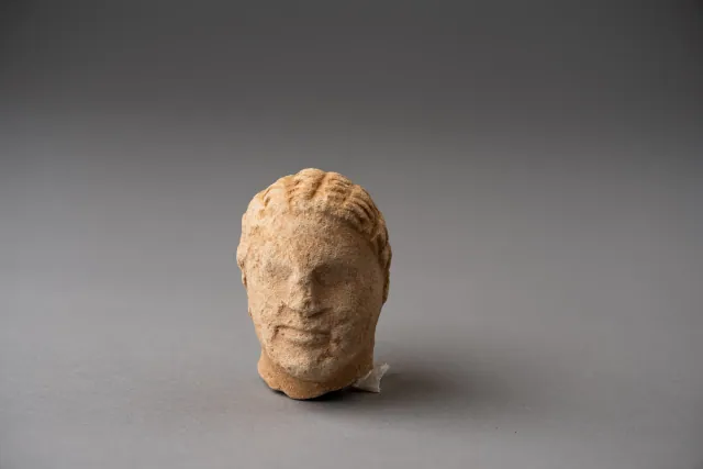 Limestone Head of a Boy, probably from a Temple Boy Statuette