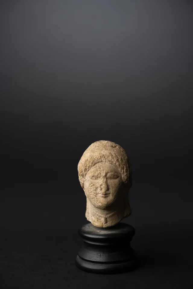 Limestone Head of a Votary with a Wreath